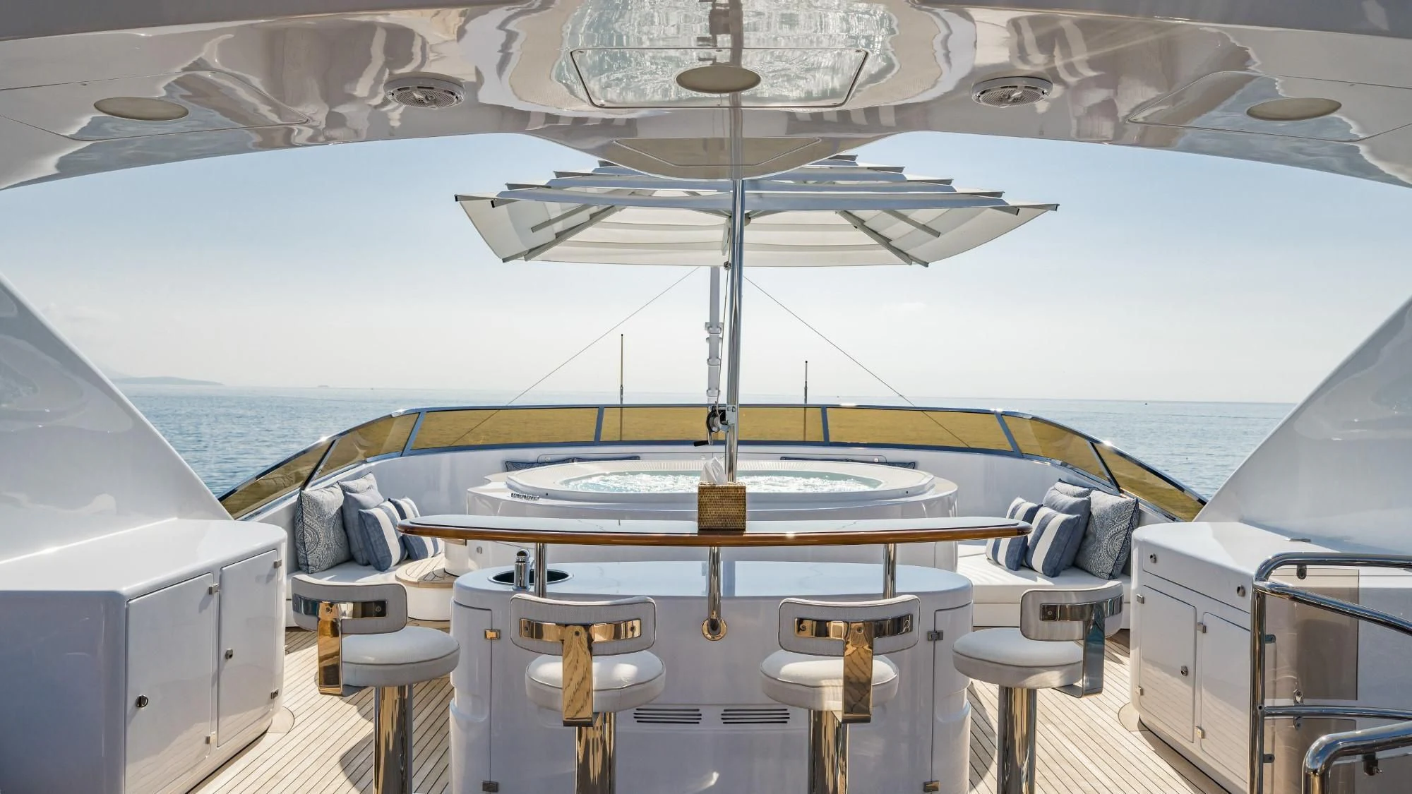 a boat with a table and chairs aboard AURA Yacht for Sale