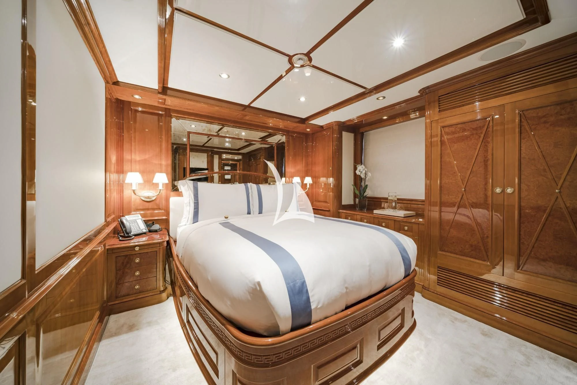 a large bedroom with a large bed aboard AURA Yacht for Sale