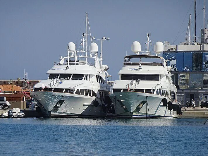 a couple of large white boats aboard AURA Yacht for Sale