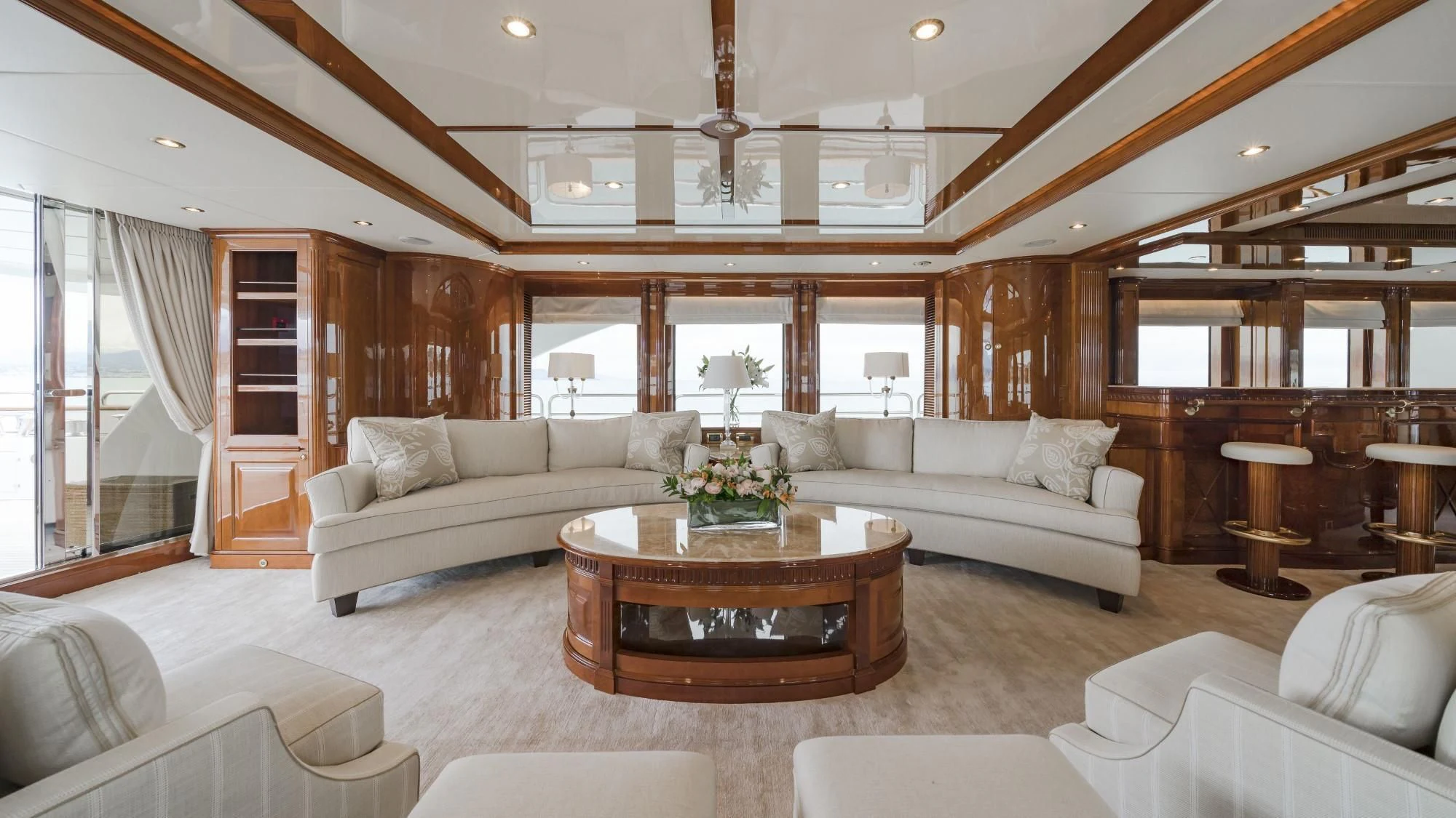 a living room with a large open window aboard AURA Yacht for Sale