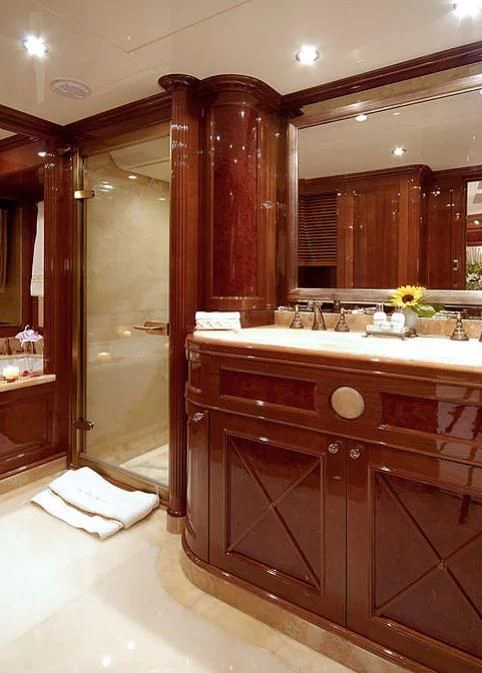 a bathroom with a large mirror aboard AURA Yacht for Sale