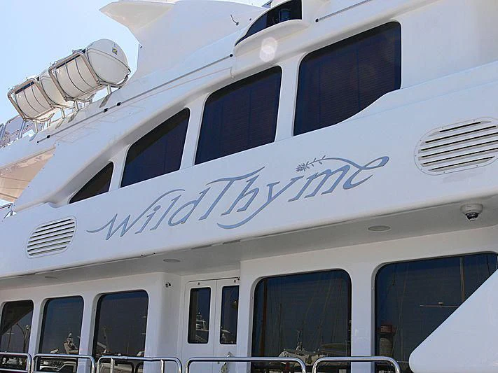 a white building with a sign on it aboard AURA Yacht for Sale