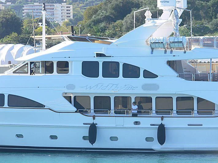 a white yacht on the water aboard AURA Yacht for Sale