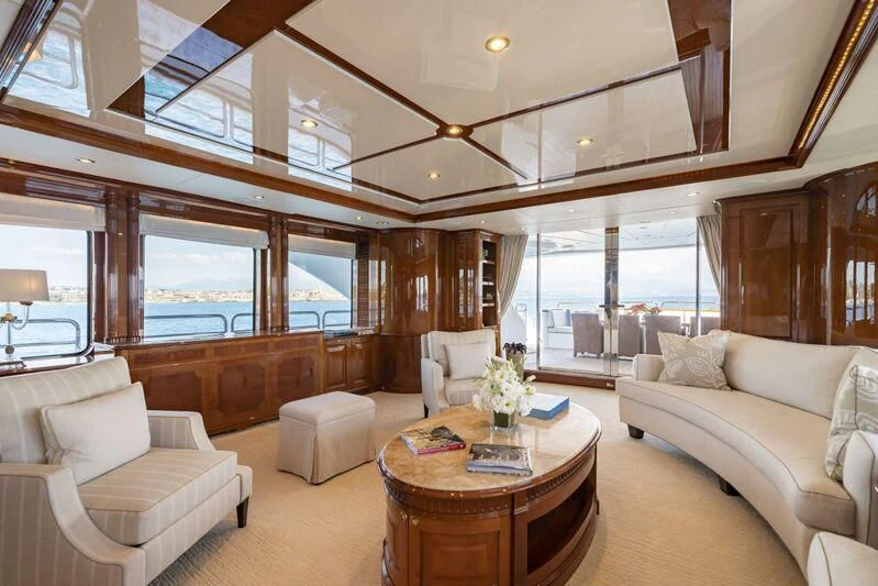 a living room with a large window aboard AURA Yacht for Sale