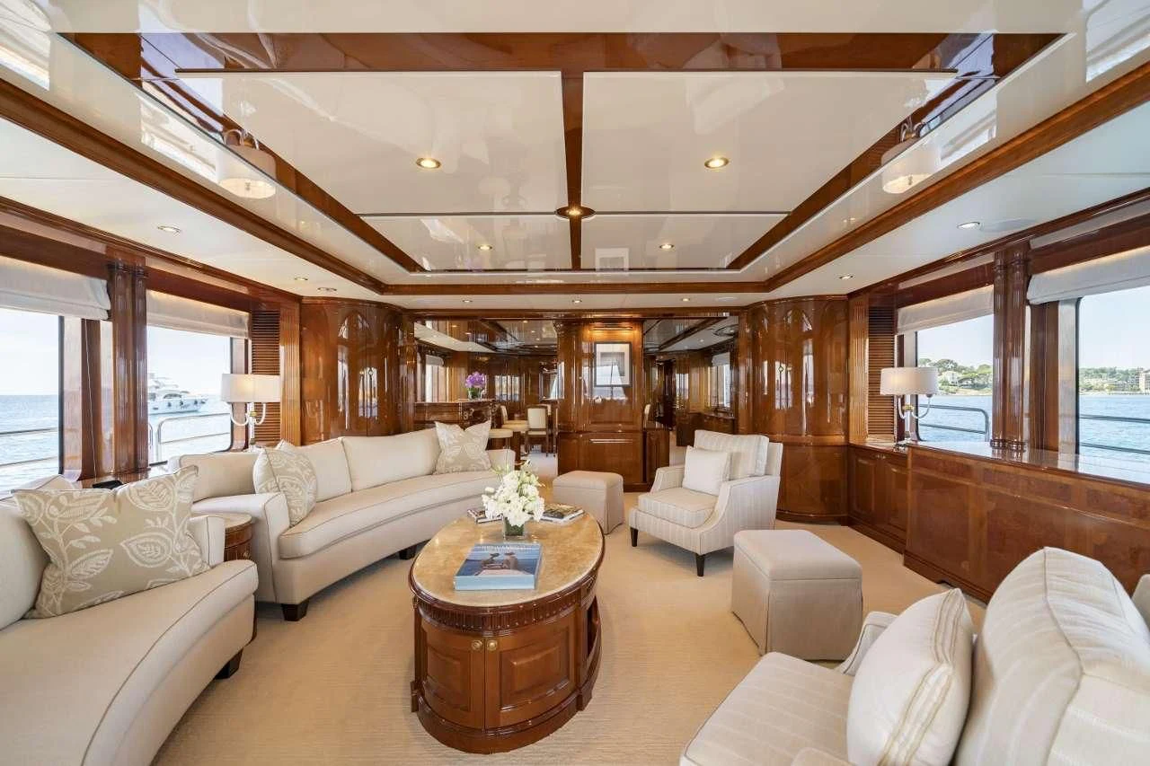 a living room with a large wood ceiling aboard AURA Yacht for Sale