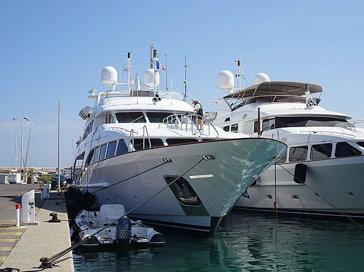 a couple of large white boats aboard AURA Yacht for Sale
