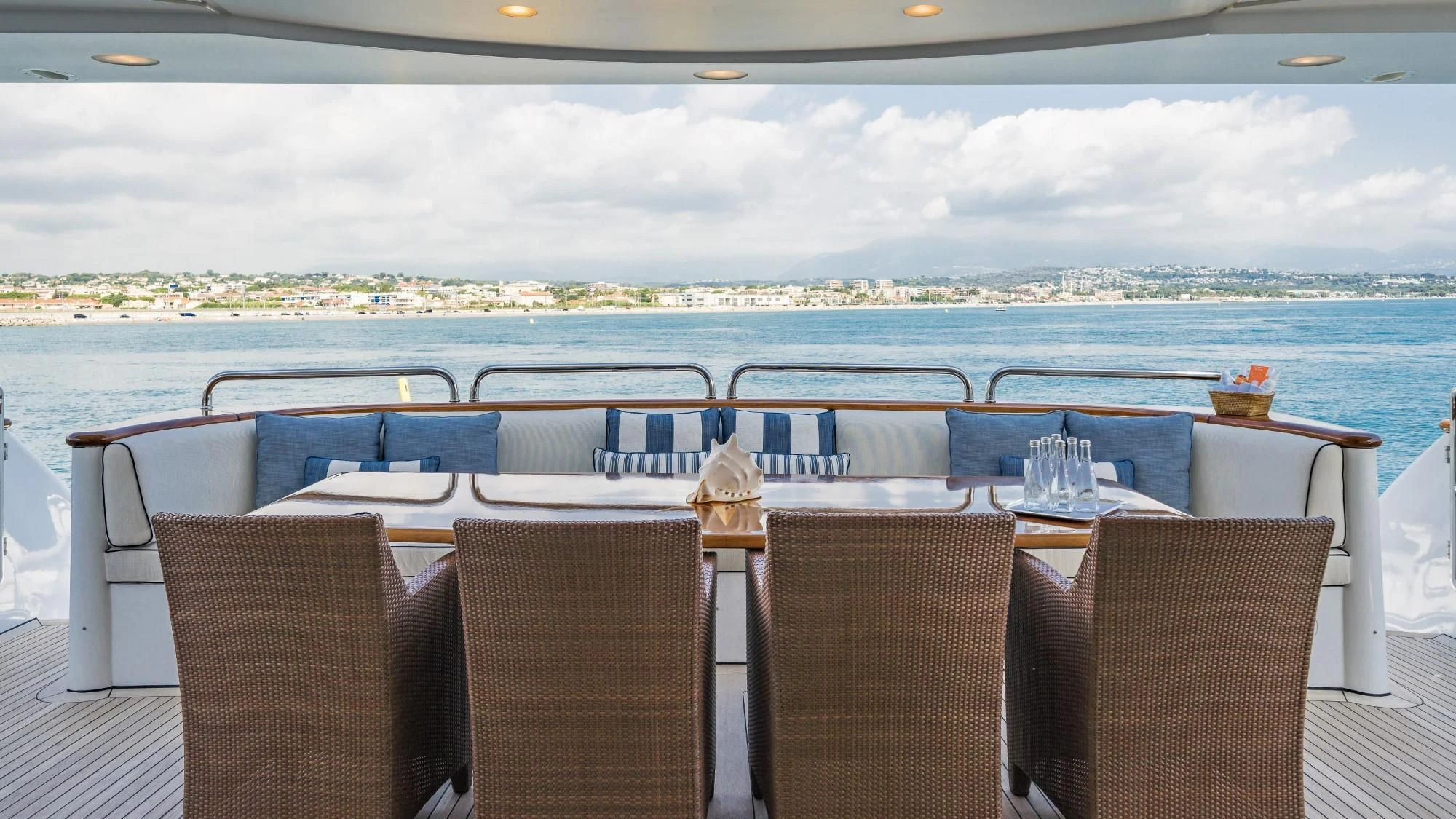 a table with chairs on it aboard AURA Yacht for Sale