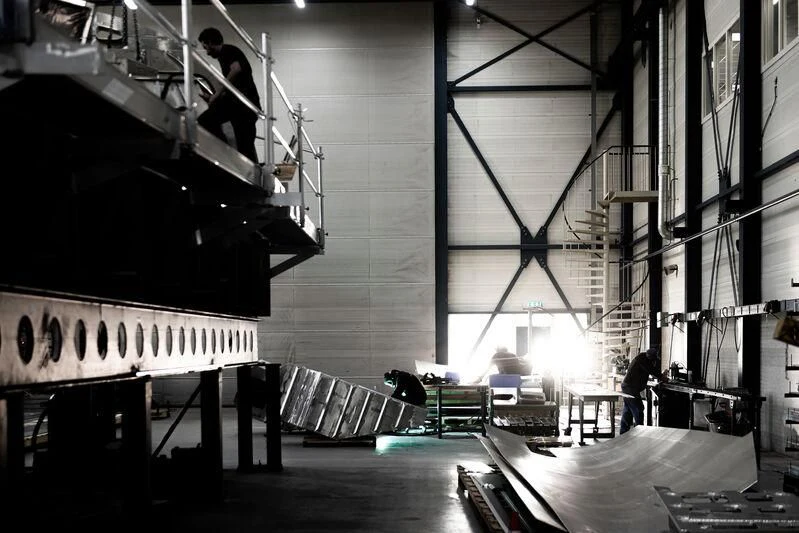 a large factory with a few people working in it aboard AQUARIUS Yacht for Sale