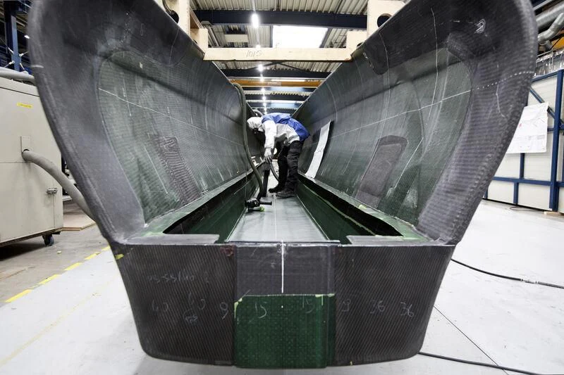 a large machine with people working on it aboard AQUARIUS Yacht for Sale