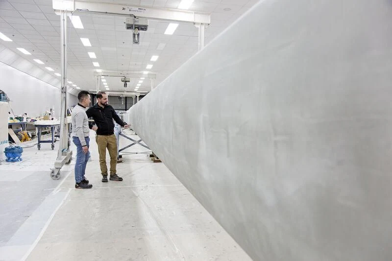 a few men in a factory aboard AQUARIUS Yacht for Sale