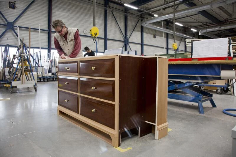 a person working in a factory aboard AQUARIUS Yacht for Sale
