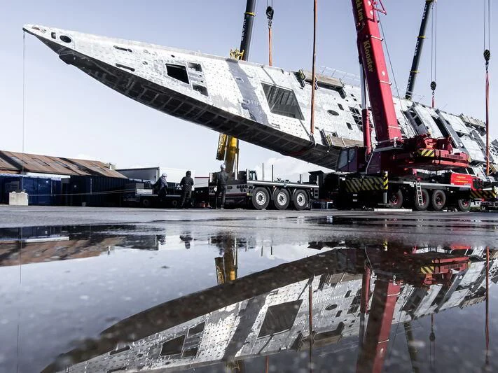 a large boat on a trailer aboard AQUARIUS Yacht for Sale