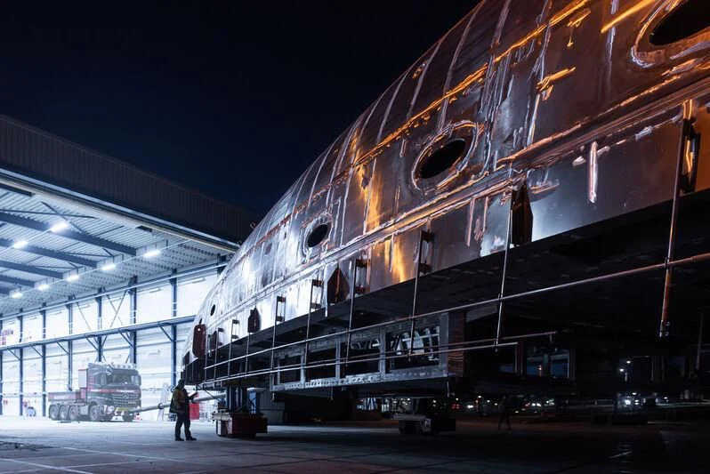 a large metal structure with a large round object on the side aboard AQUARIUS Yacht for Sale