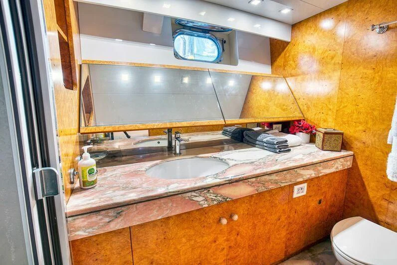 a bathroom with a sink and a toilet aboard LE CANARD Yacht for Sale