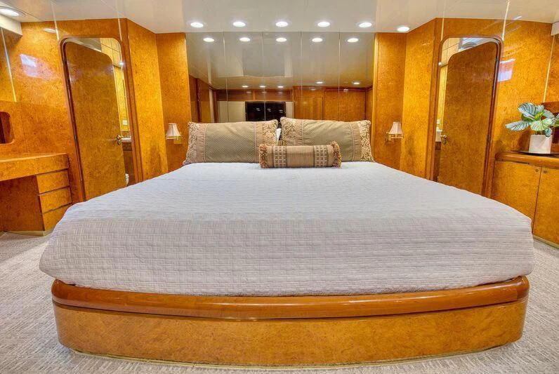 a bed in a room aboard LE CANARD Yacht for Sale