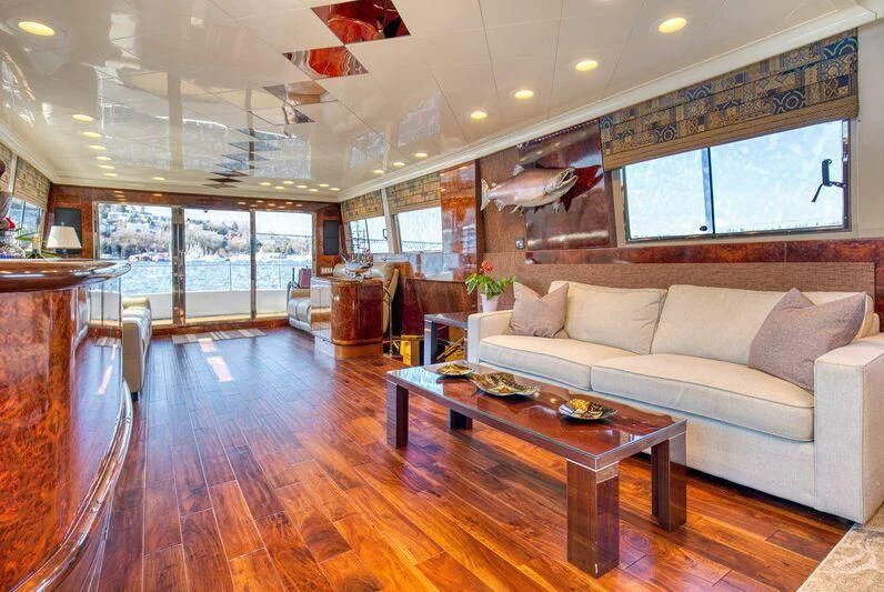a living room with a large window aboard LE CANARD Yacht for Sale