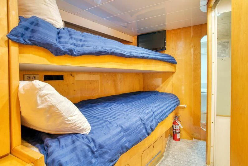 a room with bunk beds aboard LE CANARD Yacht for Sale