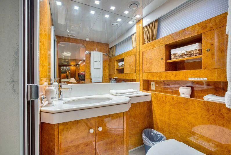 a bathroom with a sink and cabinets aboard LE CANARD Yacht for Sale
