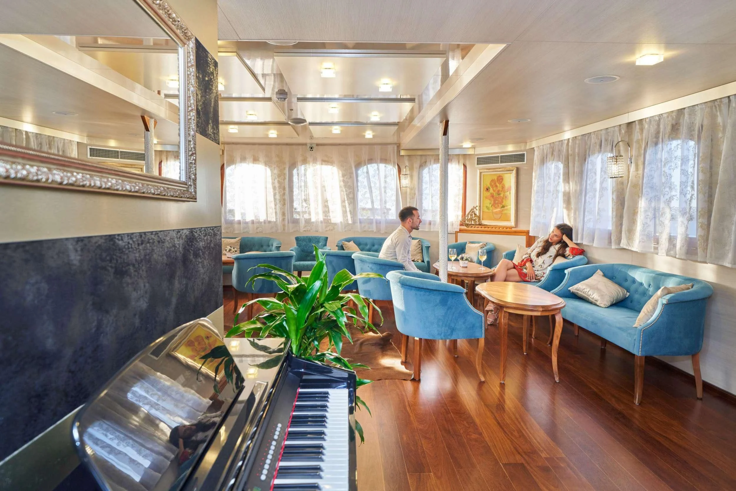 a couple of people sitting in a living room aboard CASABLANCA Yacht for Sale