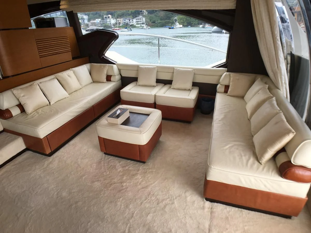 a living room with couches and a table aboard AZIMUT 75 Yacht for Sale