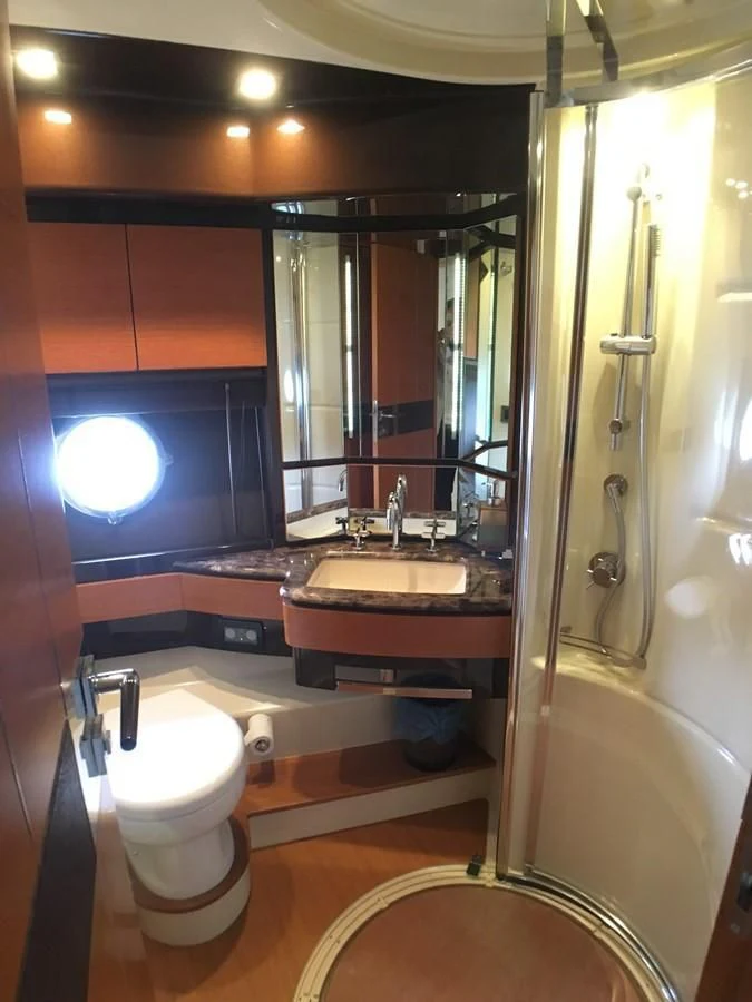 a bathroom with a toilet and sink aboard AZIMUT 75 Yacht for Sale
