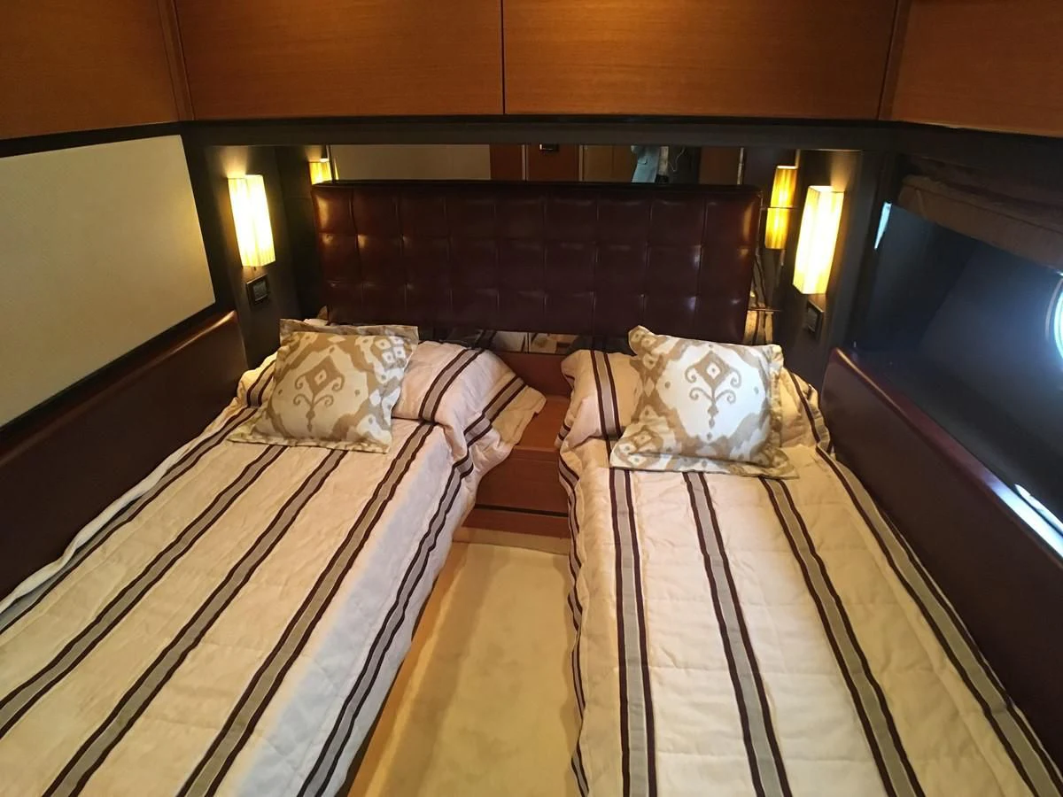a couple of beds in a room aboard AZIMUT 75 Yacht for Sale