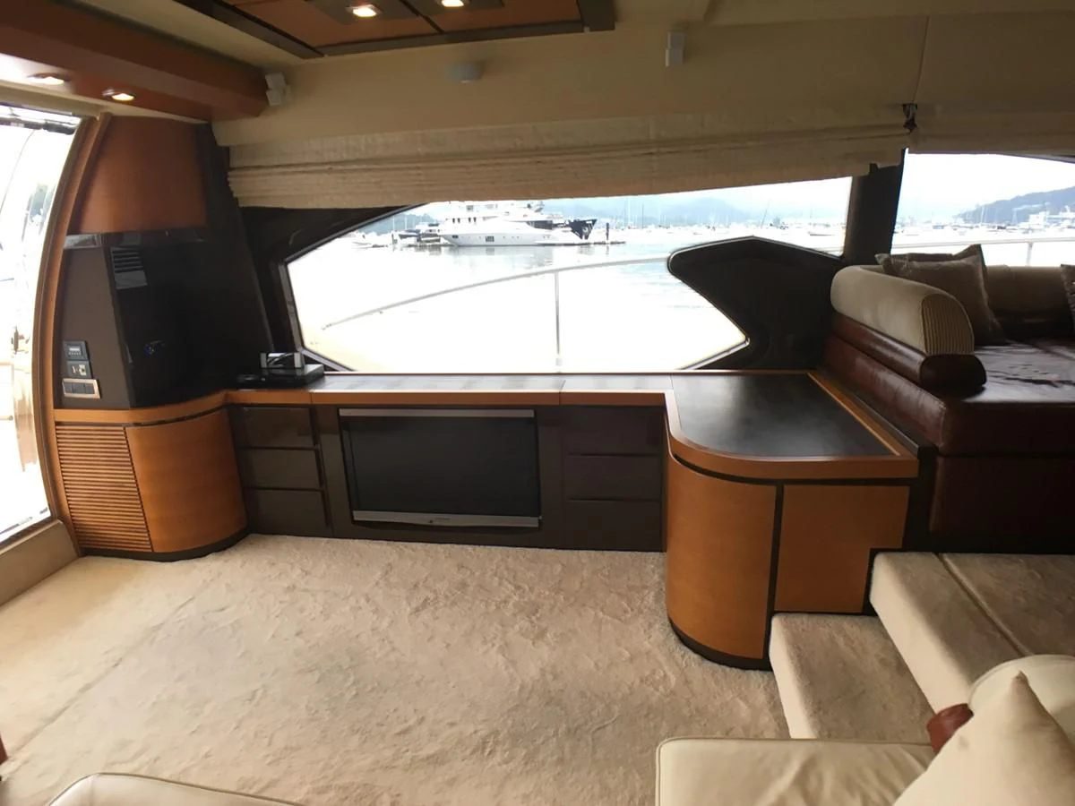 a room with a couch and tv aboard AZIMUT 75 Yacht for Sale