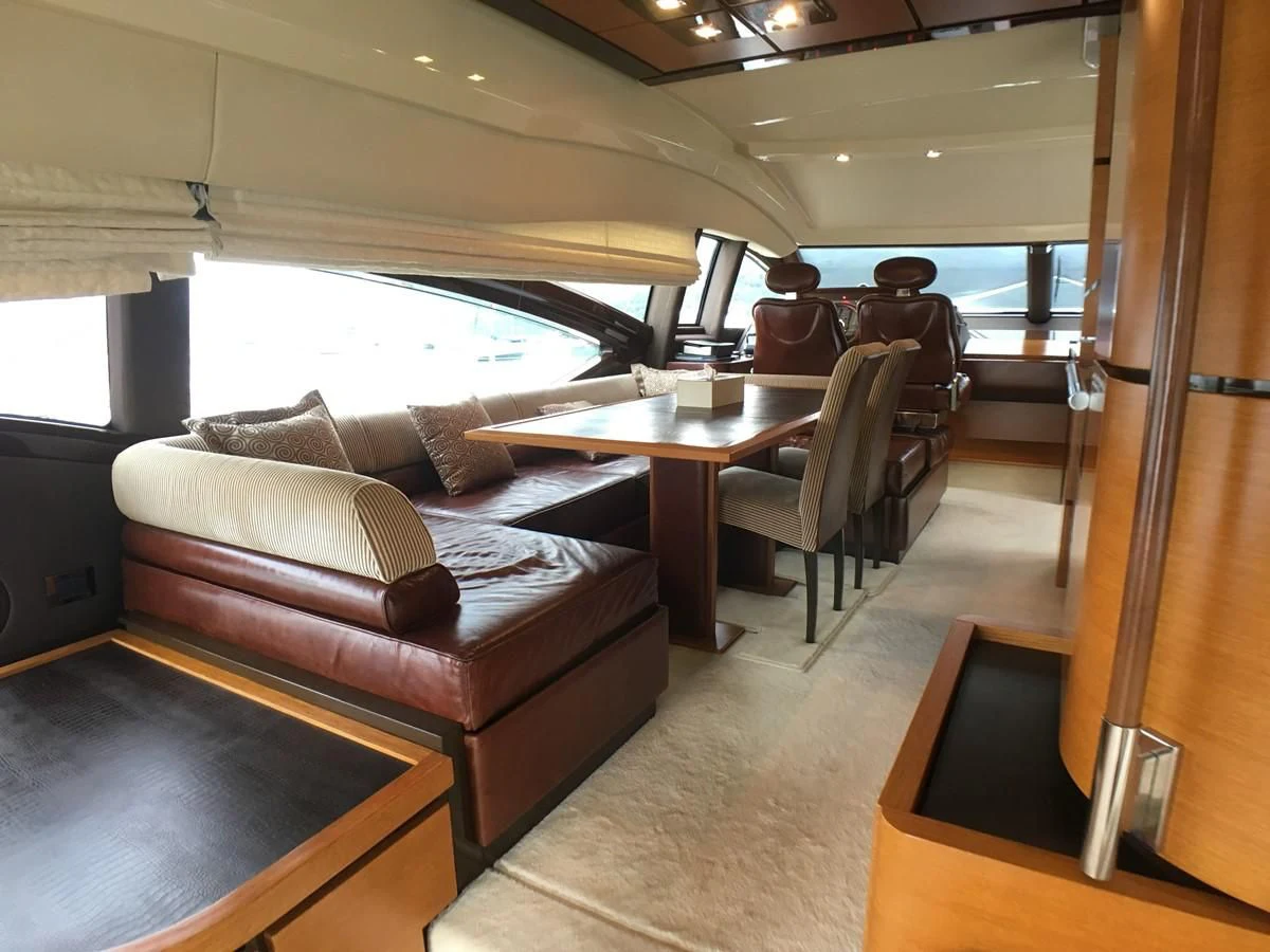 a living room with a couch and a table aboard AZIMUT 75 Yacht for Sale