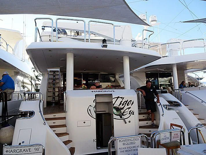 a large white boat with a group of people on it aboard OCEANS I Yacht for Sale