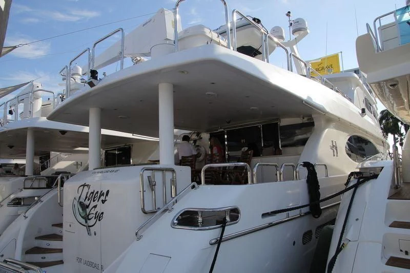 a white boat with people on it aboard OCEANS I Yacht for Sale