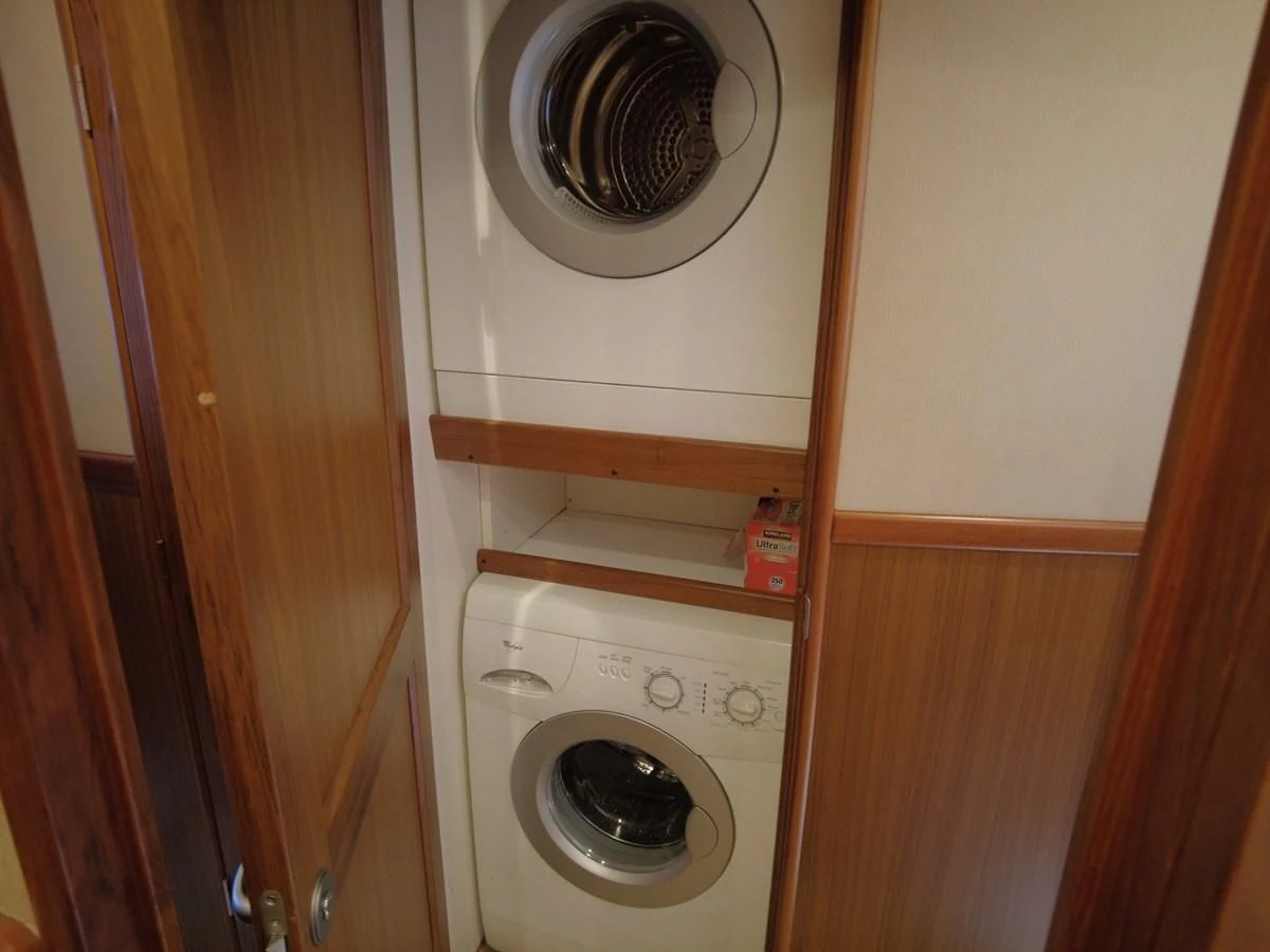 a white washing machine aboard SALT7 Yacht for Sale