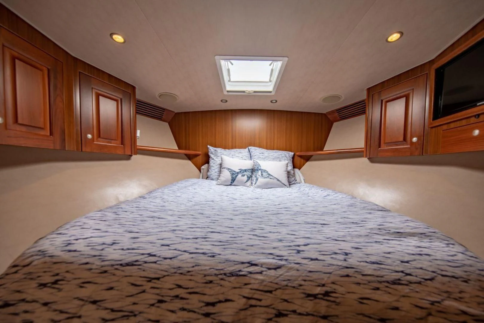 a large bed in a room aboard SALT7 Yacht for Sale