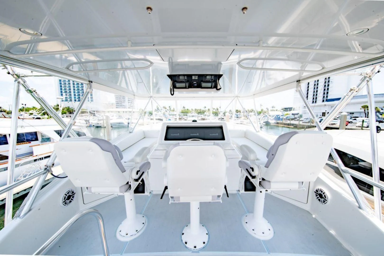 a white boat with white chairs aboard SALT7 Yacht for Sale