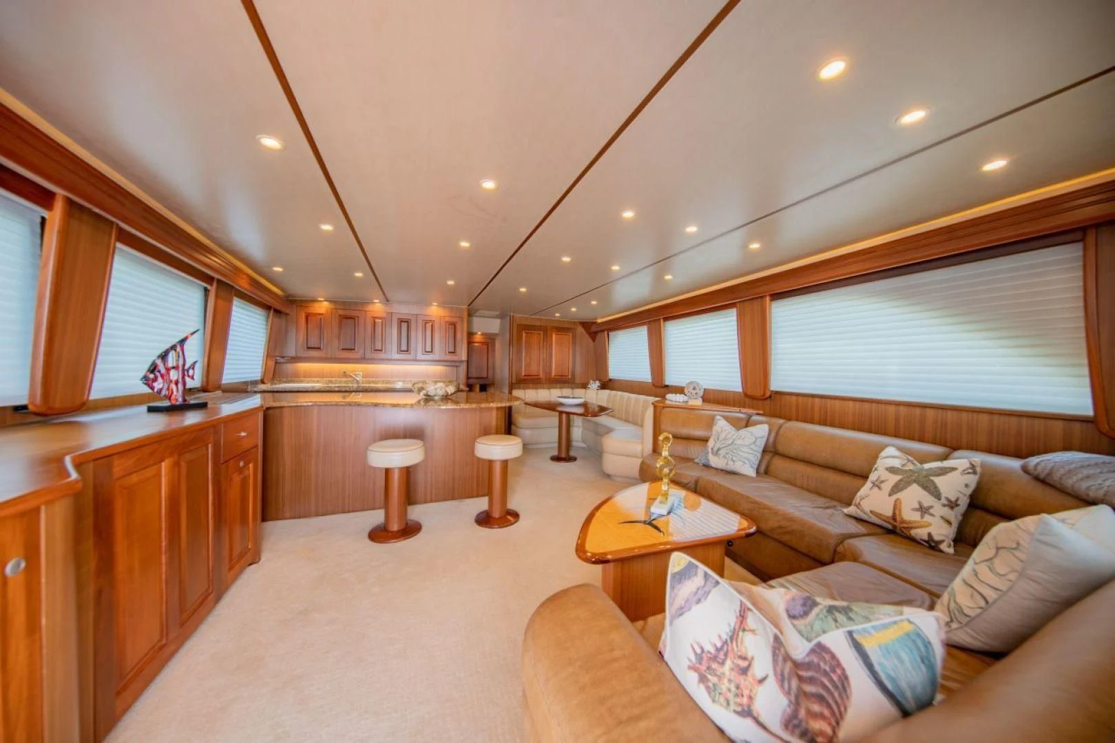 a living room with a couch and a table aboard SALT7 Yacht for Sale
