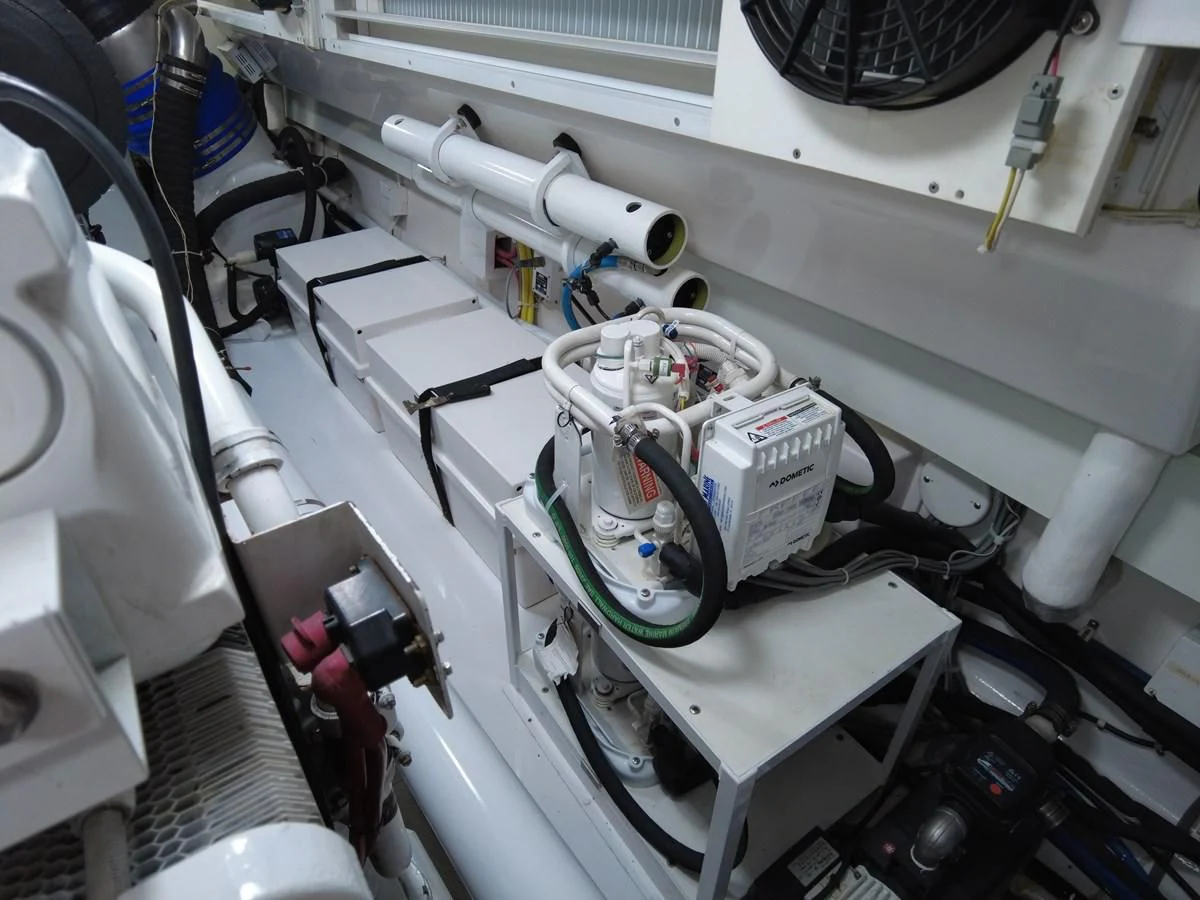 a white machine with a black object on the side aboard SALT7 Yacht for Sale