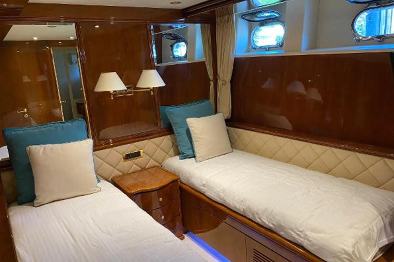 a room with two beds aboard CRISTALES Yacht for Sale