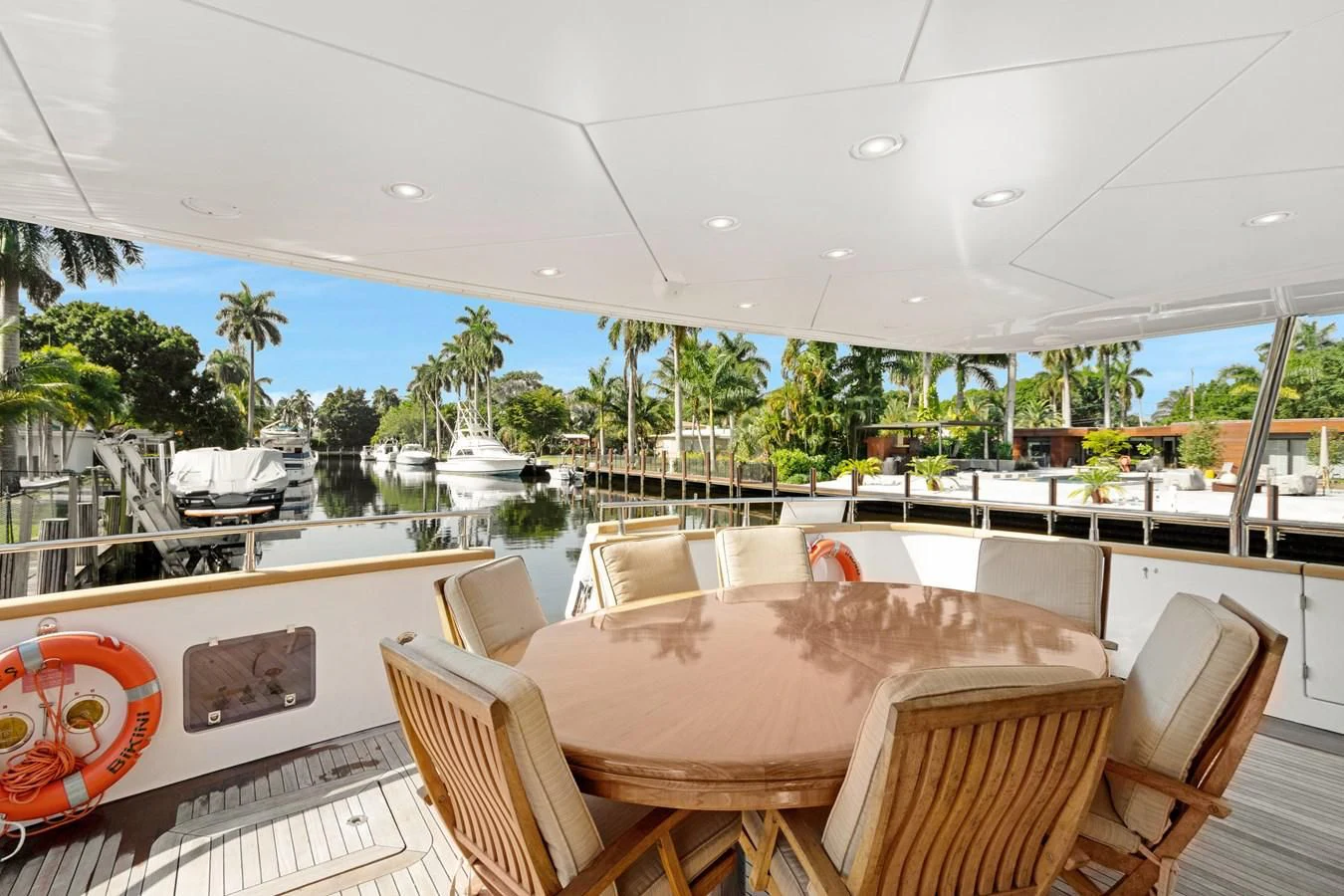 a table and chairs on a deck aboard CRISTALES Yacht for Sale