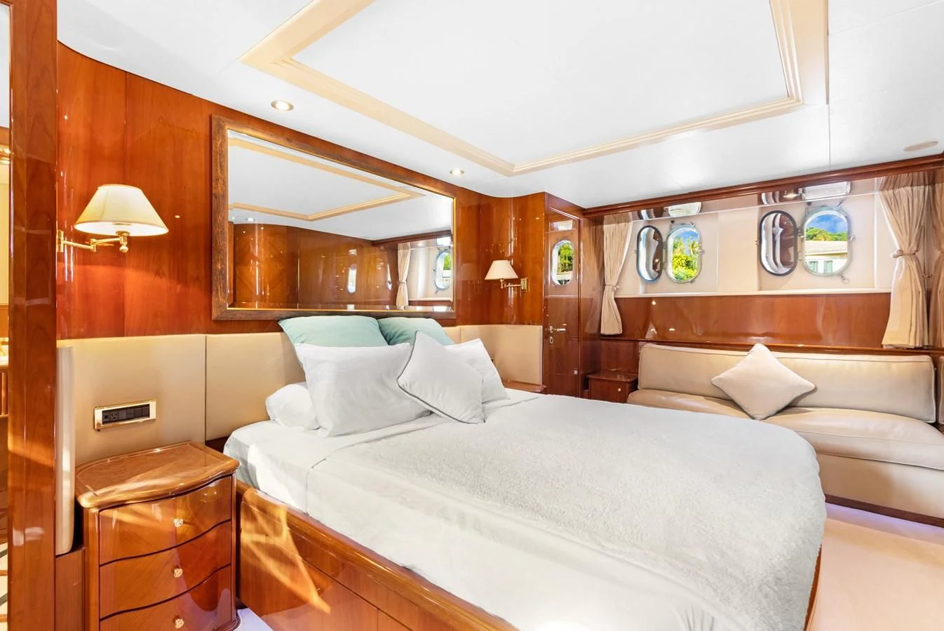 a room with a bed and a couch aboard CRISTALES Yacht for Sale