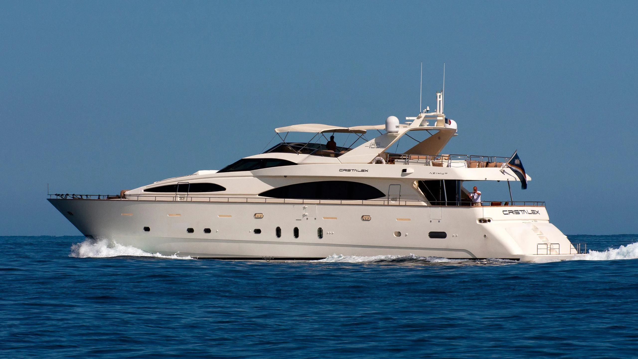 a white yacht on the water aboard CRISTALES Yacht for Sale
