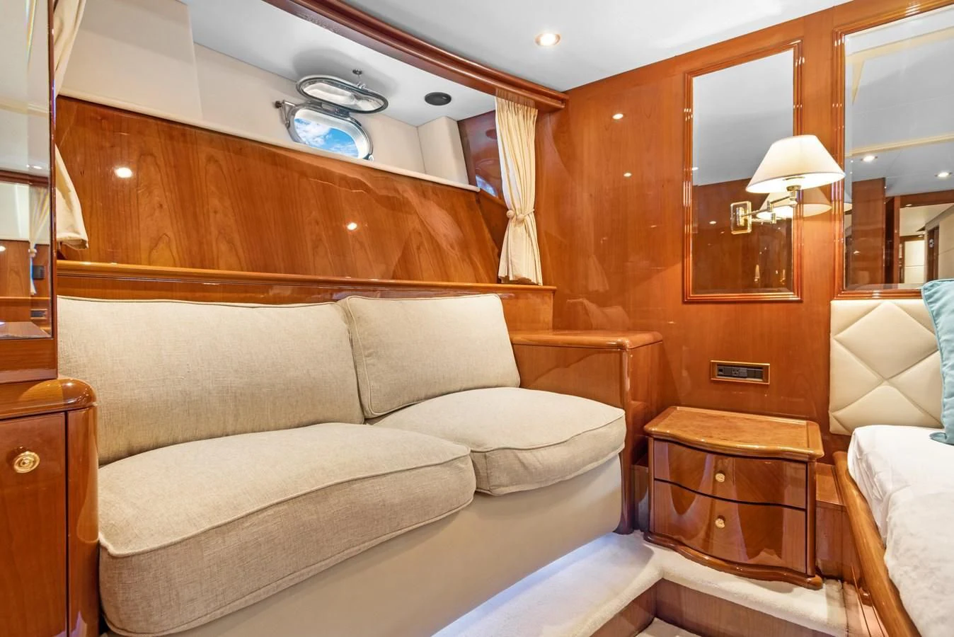 a room with a bed and a chair aboard CRISTALES Yacht for Sale
