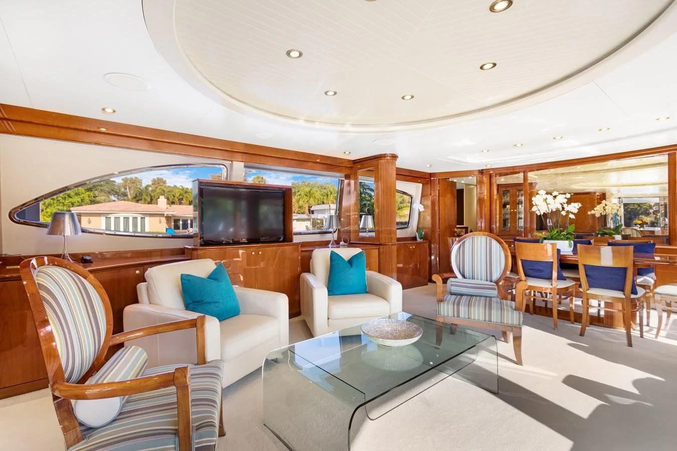 a living room with a large screen aboard CRISTALES Yacht for Sale