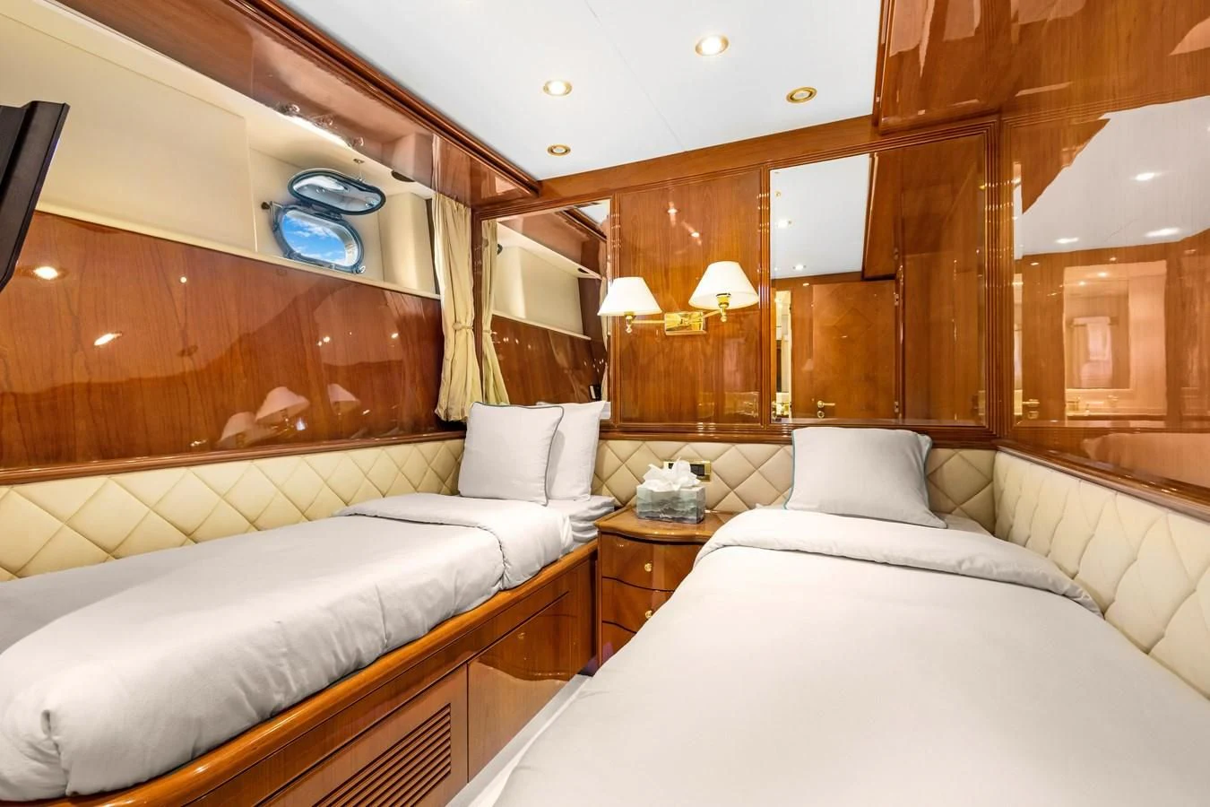 a room with two beds aboard CRISTALES Yacht for Sale