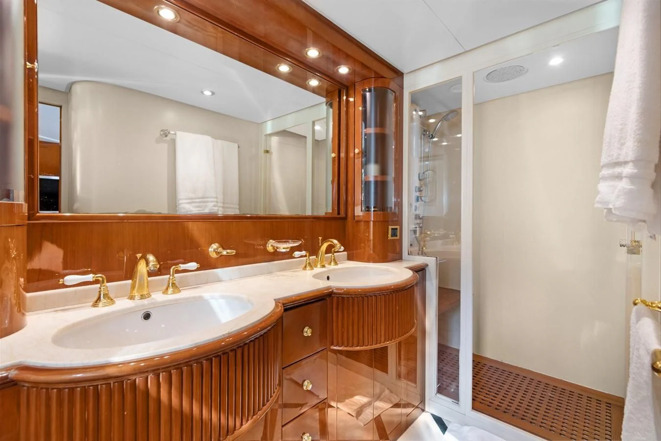 a bathroom with a large mirror aboard CRISTALES Yacht for Sale