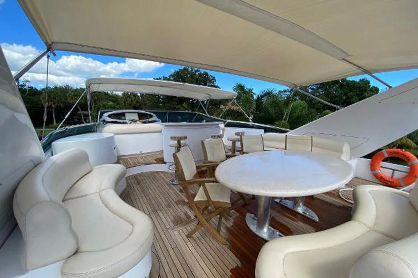 a room with a table and chairs aboard CRISTALES Yacht for Sale