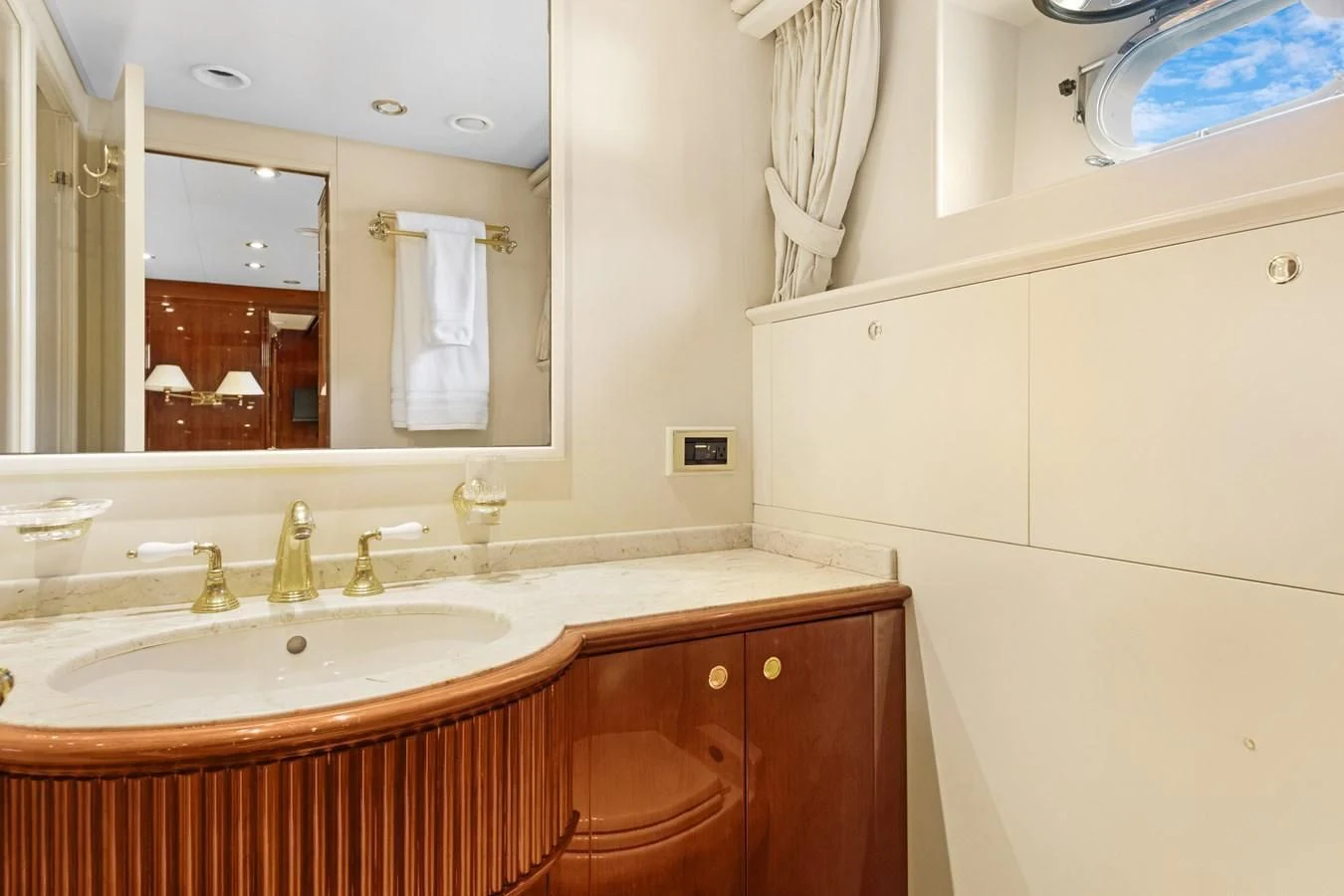 a bathroom with a large mirror aboard CRISTALES Yacht for Sale