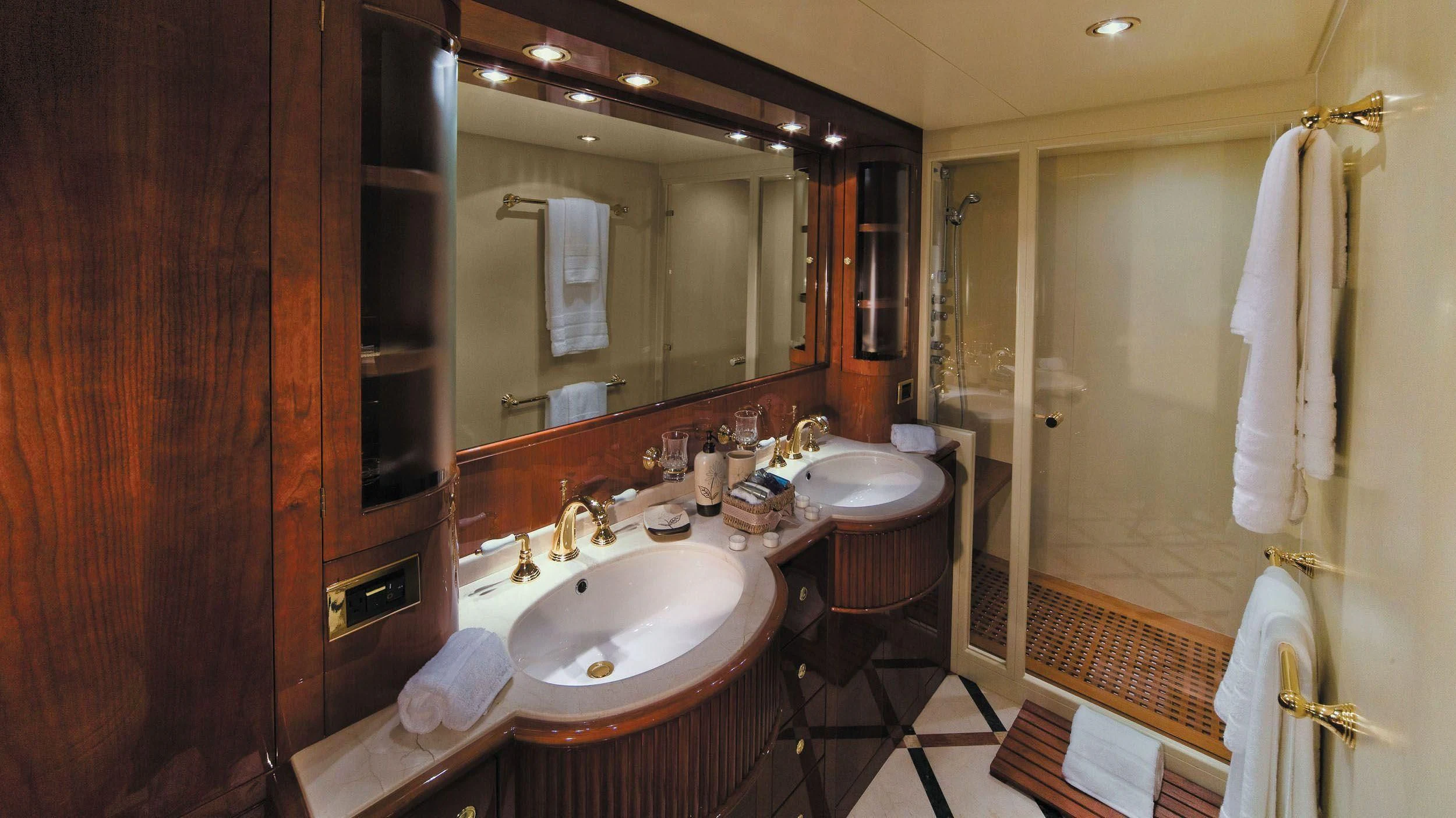 a bathroom with a sink and a mirror aboard CRISTALES Yacht for Sale