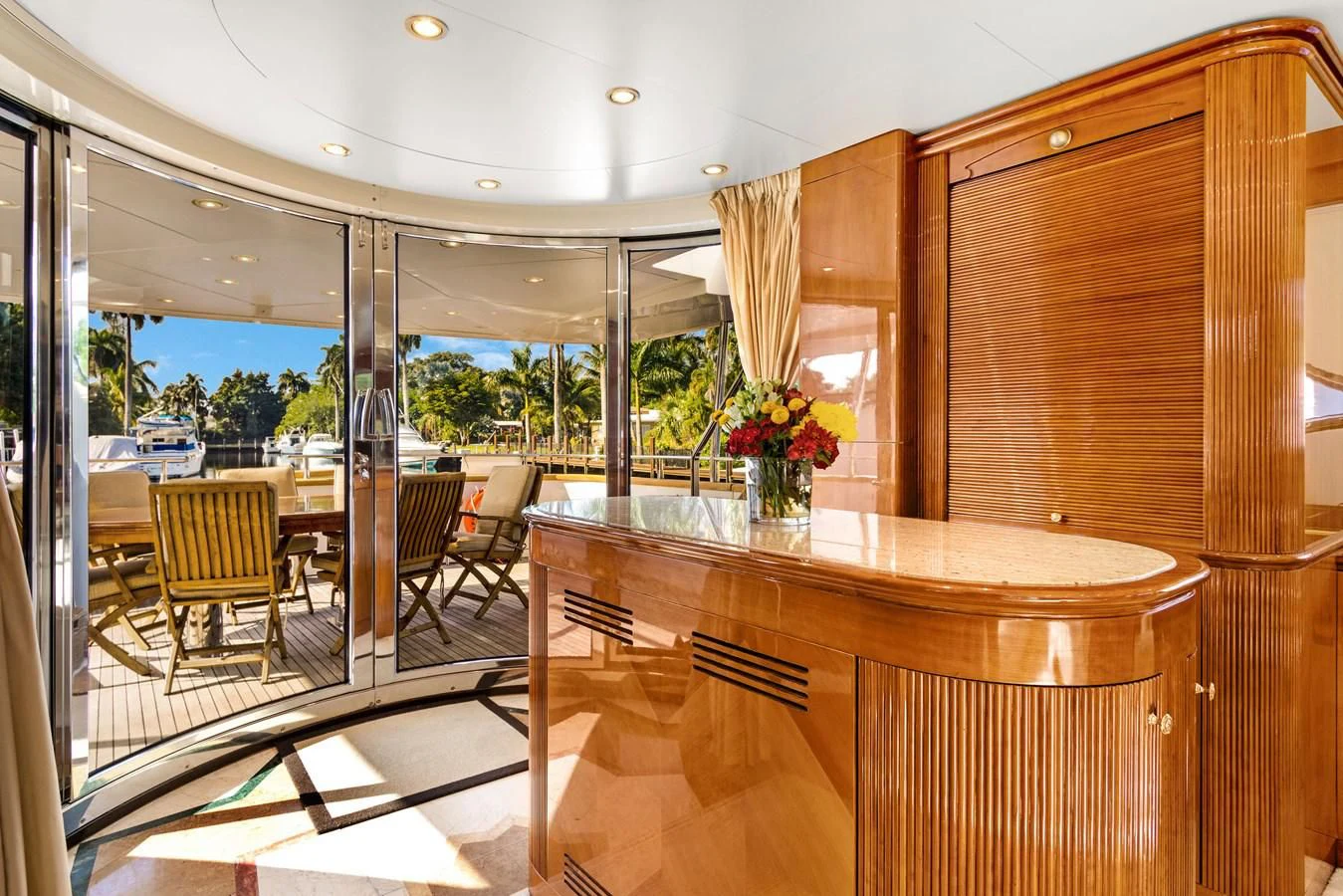 a room with a table and chairs aboard CRISTALES Yacht for Sale