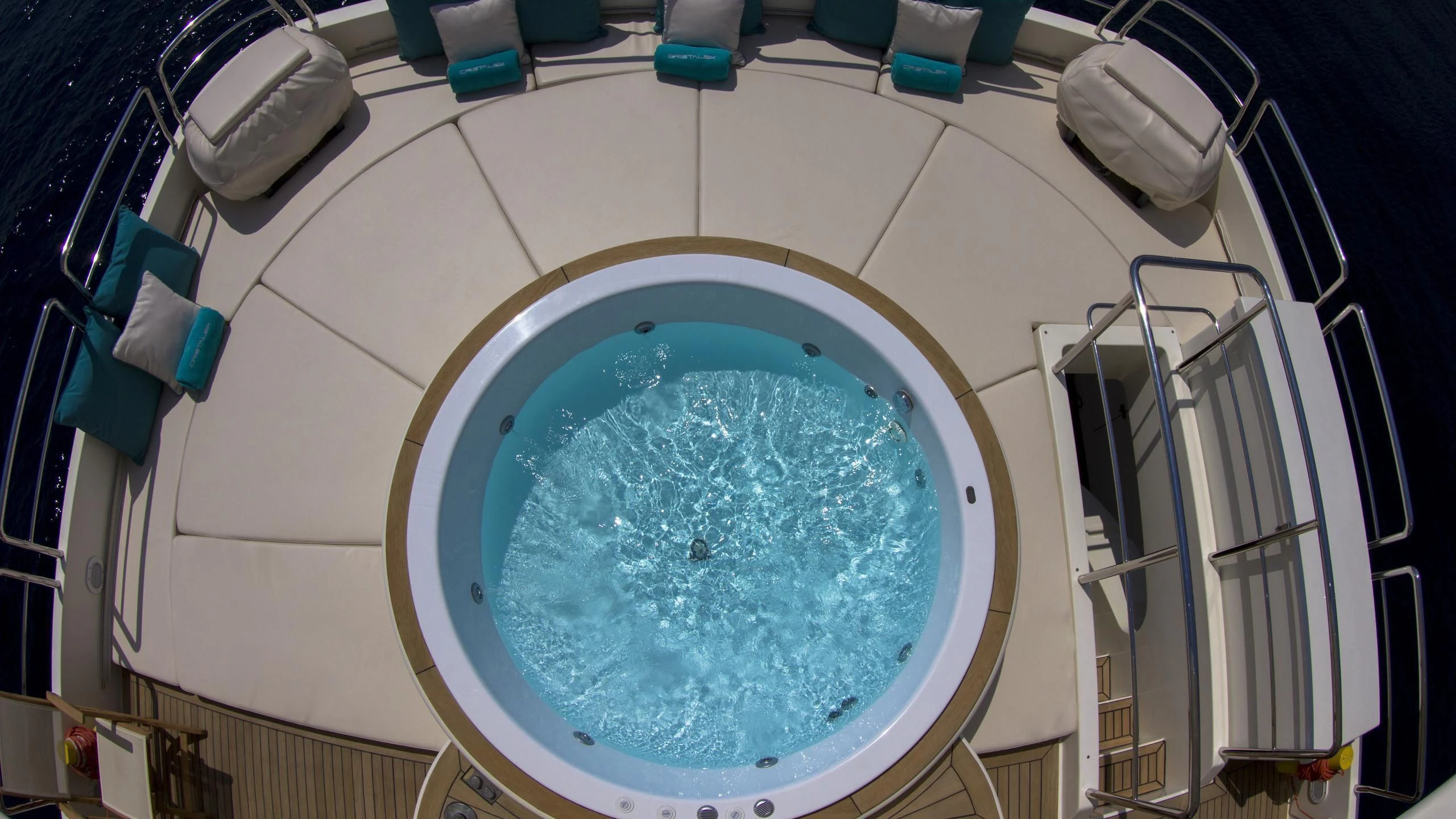 a large white plate with blue liquid inside aboard CRISTALES Yacht for Sale