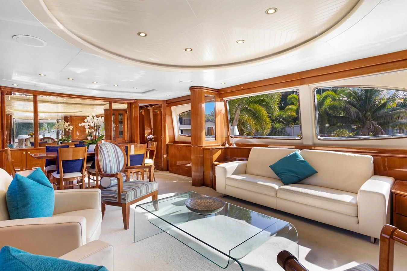 a living room with a couch and a table aboard CRISTALES Yacht for Sale