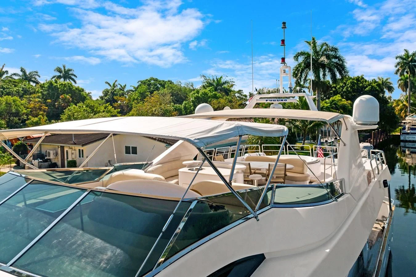 a white boat with a roof aboard CRISTALES Yacht for Sale
